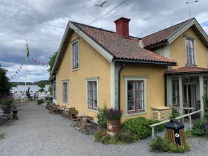Entrance and view of the sea.  at Hembygdsgårds Café in Vaxholm