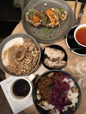 Ricotta toast, granola bowl, and the bowl of the moment with their coffee and some tea #Veganuary at Grounded in Paris