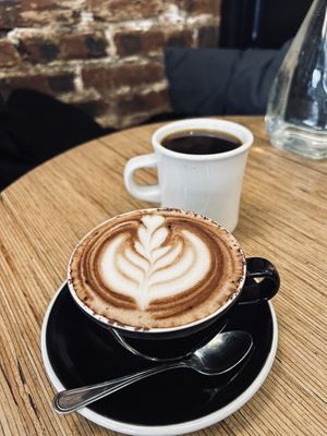 Moka with oat milk and black filter coffee.  at Grounded in Paris