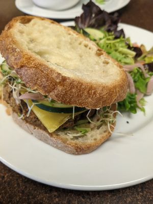 Lentil burger with side salad at Broadfork Cafe - Uptown in Seattle