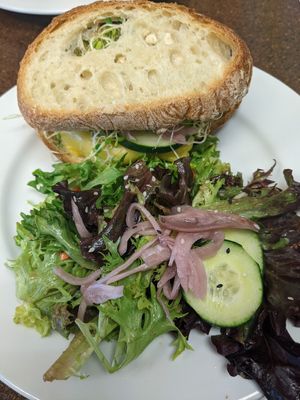 Lentil burger with side salad at Broadfork Cafe - Uptown in Seattle