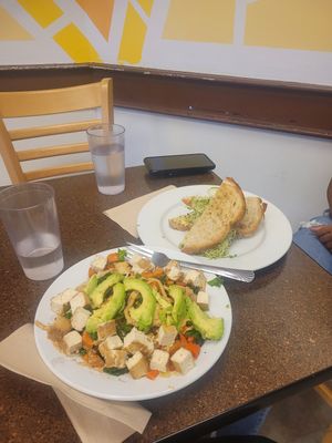 Veggie bowl with added tofu and artichoke sandwich at Broadfork Cafe - Uptown in Seattle