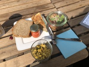 Tofu scramble, quiche, potato salad with apple and beets and bell pepper cream  at Kune in Leipzig