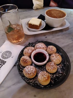 tiny piece of delicious carrot cake😒and dough balls - never eaten them before, not bad, but I won't take them again... at Pizza Express - Aldwych in London