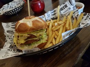 Chicken style burger & fries - Double breaded meat free patty, dairy free cheese, red pepper salsa and guacamole at The Yard in Ilkley