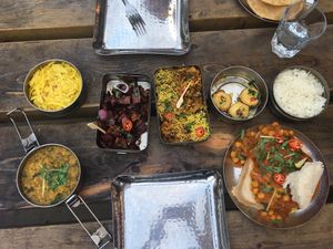 Yogurt chat bombs, bhel puri, treacle tamarind fries, holy chow, green ginger rhubarb dhal and calcutta tangled greens at Mowgli in Oxford
