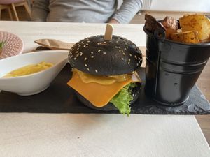 Beyond burger with potato wedges and mayo  at Sublimmme in Bucharest