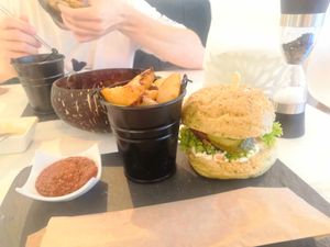 Chickpea burger and baked potatoes with a spicy sauce  🍔 at Sublimmme in Bucharest
