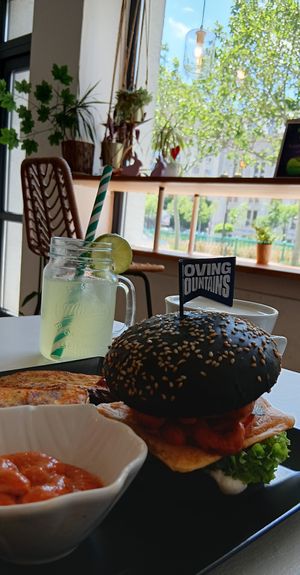 Mushroom burger, baked potatoes, spicy sauce, ginger lemonade, nice view at Sublimmme in Bucharest