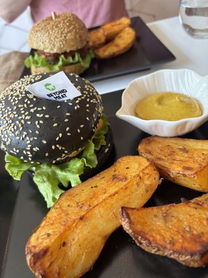 Beyond burger with baked potatoes and the house BBQ burger.  at Sublimmme in Bucharest