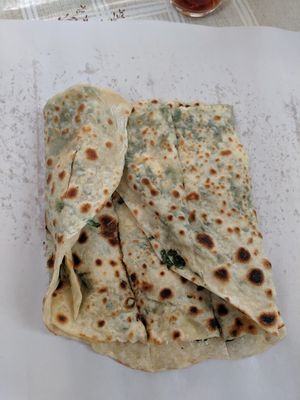 Freshly cooked flatbed made with your choice of ingredients. at Feriköy Organic Bazaar in Istanbul