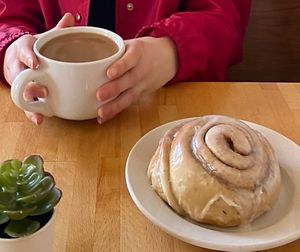 decaf coffee with soy & cinnamon roll  at Vegan East in Minneapolis