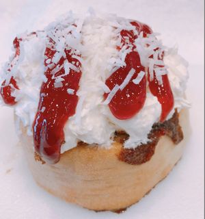 Coconut Frosting with Shredded Coconut & Strawberry Jam! at Cinnaholic in Winnipeg