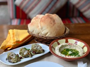 Hummus beiruti, baba ganoush and Arabic bread. at Al Sham in Dushanbe