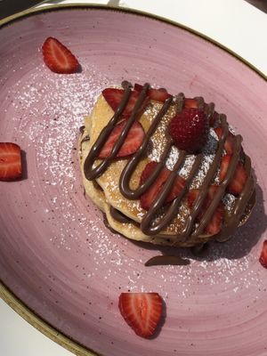 Vegan pancakes with strawberries and vegan chocolate  at Creme Cafe in Lanzarote