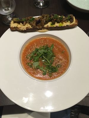 Gazpacho (cold soup) and a crostini with hummus and cooked vegetables at La Tomate Noire in Corsica