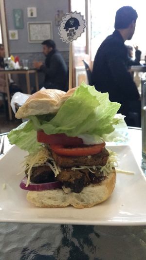 The most popular item - Sandwich with seitan, bbq, tofu, vegan cheese, lettuce, tomato, and avocado - Comes with fries at Vegan Dealer in Santiago