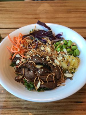Salad bowl with Teriyaki Gardien chicken strips, pineapple, and edamame  at Cafe Surfinista in Indialantic