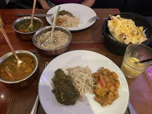Curries, garlic naan, mango lassi, all vegan    at Royal India in Ghent