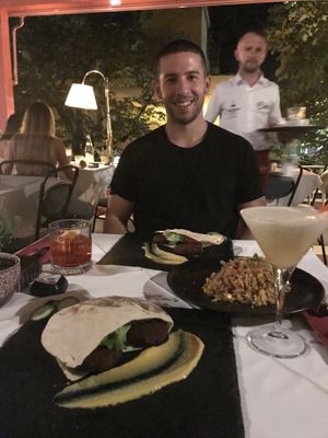 Our vegan burgers which came in pita bread, and a vegan risotto as a side. at Çoko in Tirana