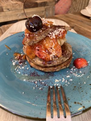 Pancakes with peanut butter, orange slices, and strawberries  at Peanut's Café in Sainte-maxime