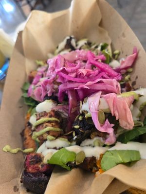 loaded sweet potato with baked tofu, pickled cabbage & onions, roasted beets, pepitas & cashew sour cream at Sita's Kitchen  in Trinidad