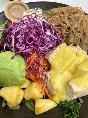 Signature Plate with sweet potato noodles, rainbow salad, mango tofu (I don’t recommend the flavor), peanut soy dressing, and added avocado 🥑   at Nancy's Sky Garden in Austin