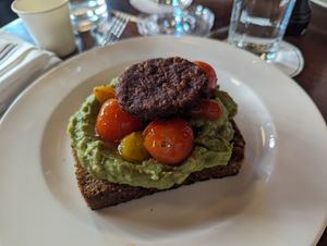 Avocado toast with a plant based breakfast patty at Jack's Stir Brew Coffee - Tribeca in New York City