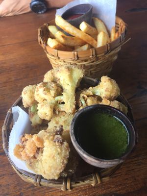 Cauliflower wings and fries (25k each) at Shelter Cafe in Seminyak