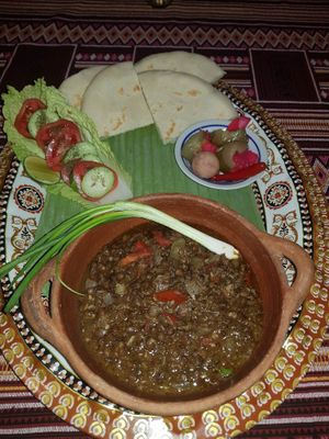 Black Lentils stew with onions, garlic and tomato, serve with pita, Salad and pickles. at The Pharaoh's Restaurant in Vientiane