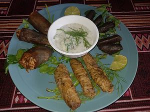 VEGAN Mix Dolma platter
Cabbage, Grape leaves and Eggplant dolma, serve with Egyptian Green Salad at The Pharaoh's Restaurant in Vientiane