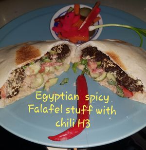 Egyptian Spicy Falafel in pita Fried falafel stuffed with chili, laid over salad and tahini Sauce.
 at The Pharaoh's Restaurant in Vientiane