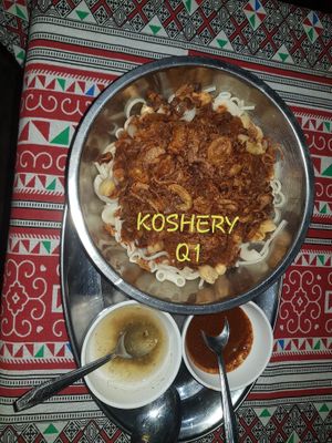   KOSHERY 
( VEGAN Best sillier Dish) 
       Layers of white rice, Macaroni, Spaghetti, black lentils, chickpeas topped with special tomato garlic sauce and fried onions.
 at The Pharaoh's Restaurant in Vientiane