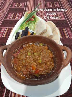 Fava Beans stew in tomato garlic sauce and red chili pepper, serve with pita and pickles.
 at The Pharaoh's Restaurant in Vientiane