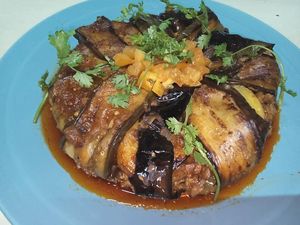 Moussaka tajine is made from layers of potato at the bottom topped  with zucchini) then a slices of fried eggplant immersed in tomato sauce cover all ingredients and backed.75,000  at The Pharaoh's Restaurant in Vientiane