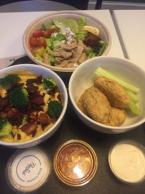 Mac n Cheese (with bacon and broccoli) Caesar salad and buffalo wings at Flipside in London