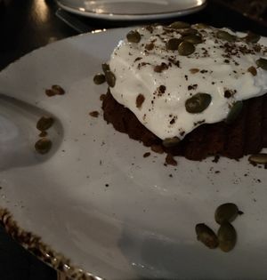 Ginger molasses cake with vegan cream cheese frosting and candied pepitas   at Our Harvest in Fenwick Island
