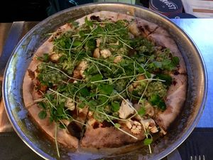 Vegan flatbread with potato confit, garlic, roasted shallots, and radish.  at Our Harvest in Fenwick Island