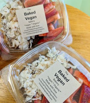 Raw gluten free chocolate avocado mousse with coconut flakes, berries, cacao nibs, cinnamon and hemp seeds at The Baked Vegan Bakery in Lake Park