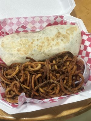 Phat Burrito and curly fries. So good 😀  at Blue Sage Vegan Bistro in Little Rock