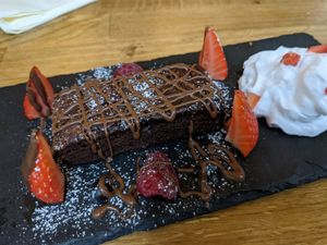 Brownie with whipped cream at Veggie Republic in Liverpool