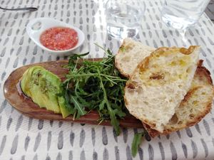 Bread with olive oil, greens, tomato, and avocado at La Concepción in Tenerife