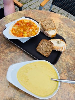 Syrian soup on the top left, cauliflower cream on the bottom. Comes with two slices of bread  each.  at Jelo in Weimar