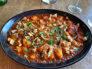 Vegan baken potato gnocchi oven baked in tomato & basil sugo topped with candied pumpkin, pangrattato, vegan mozzarella at Rococo in Hawthorn