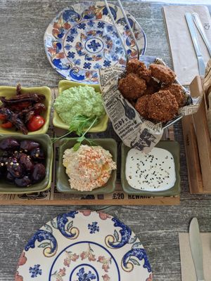 Family Platter: Home-made falafel balls, mint pea, tahini, hummus dips, olives, cherry and sun-dried tomato with balsamic glaze, served with warm ftir at Balance Bowl in Gzira