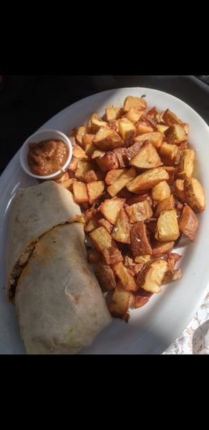 Vegan breakfast burrito and breakfast potatoes at Herms Inn in Logan