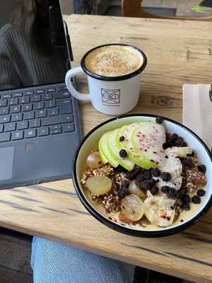 Mango and passion fruit frozen bowl with a golden latte ❤️ at Wild & The Moon - Saint Honoré in Paris
