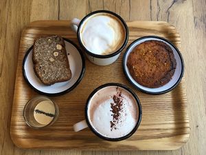 Banana cake with cashew sauce, latte, chocolate chaga and a cookie  at Wild & The Moon - Saint Honoré in Paris