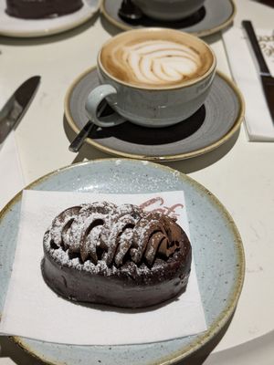 Vegan chocolate cake and oat flat white at Café Du Parc in Killarney