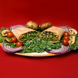 The Love Wrap:  Air-Fried Mushrooms + Kale + Red Onions + Tomatoes + Avocado + Wild Rice with a Vegan Mayo Drizzle in a Wrap. at Juiceade in Bronx